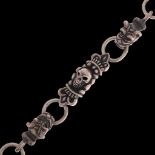 WITHDRAWN - A heavy sterling silver skull and bulldog link chain bracelet, 20cm, 69.1g . Condition R