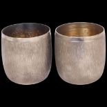 GERALD BENNEY CBE (1930 - 2008) - a pair of Elizabeth II silver drinking beakers, London 1971 and
