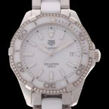 TAG HEUER - a lady's stainless steel and white ceramic diamond Aquaracer quartz calendar bracelet