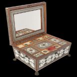 A 19th century Indian ivory and micro-mosaic sewing box, with fitted interior and brass lion paw