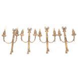 A set of 4 cast-brass twin-branch wall light fittings, height 38cm