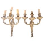 A pair of cast-brass 3-branch wall light fittings, with ram's mask decoration, height 31cm