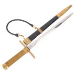 A Swedish Air Force model 1930 dagger by WKC Solingen, with brass mounts and leather sheath, three