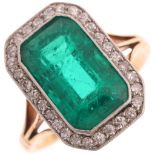 An Art Deco 18ct gold emerald and diamond cluster ring, platinum-topped, rub-over set with 3.80ct