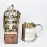 An Elizabeth II Silver Christening Mug, and a Set of Travelling Bottles, the mug by Mappin & Webb,