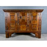 A 17th Century Continental Oak Press Cupboard, with two plank top, the gadroon carved frieze with