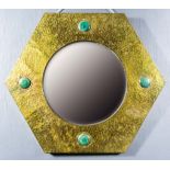 A Hexagonal Arts and Crafts Style Wall Mirror, the hammered brass frame in the Liberty Style with