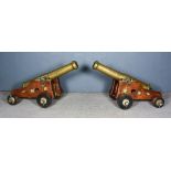 A Fine Pair of 19th Century Bronze Barrelled Cannons, each on iron and oak truck, each bearing a