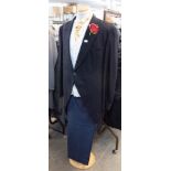 APPROX 20 BLACK TAILCOATS, SIZES 44-50, APPROX 20 BLUE PIN STRIPED TROUSERS, SIZES 38-50 AND