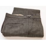 APPROXIMATELY 36 BLACK PIN STRIPED TROUSERS, various sizes