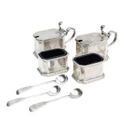 A George V silver four piece cruet set and spoons