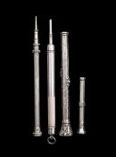 A group of four gold propelling pencils