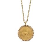 A mounted Krugerrand and chain