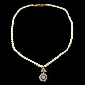 A diamond pendant and pearl necklace