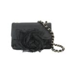 A Chanel 'Camellia' evening black mini flap bag