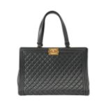 A Chanel 'Boy' black calfskin hand bag