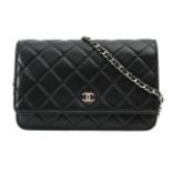 A Chanel Classic 'Wallet on Chain' black lambskin cross-body bag
