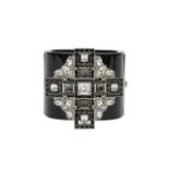 A Chanel cross wide cuff bracelet