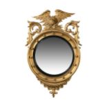 A Regency convex gilt wall mirror,