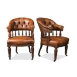 A pair of leather upholstered mahogany armchairs, circa 1900,