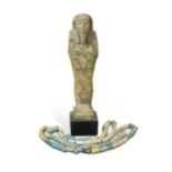 An Egyptian faience shabti figure, impressed with hieroglyphics,