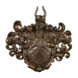 A carved and stained wood armorial shield crest, probably 18th century,