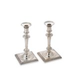 Calderwood, Robert - A pair of George III Irish candlesticks,