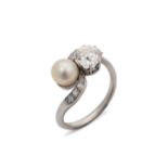 An early 20th century diamond and cultured pearl crossover style ring,
