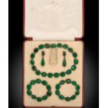 A 19th century cased green paste demi parure,