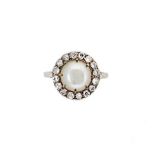 An early 20th century pearl and diamond cluster ring,