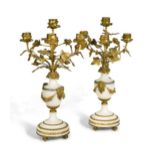 A pair of Louis XVI style four-light candelabra,