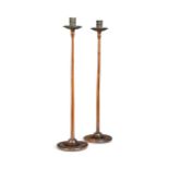 A pair of slender mahogany candlesticks, late 19th century,