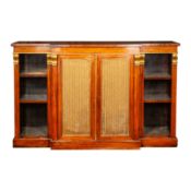 A Regency rosewood and parcel gilt breakfront open bookcase in the manner of Gillows,