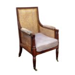 A Regency mahogany bergère armchair in the manner of Gillows,