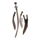 An Indian talwar, 18th / 19th century, along with two Nepalese kukri, late 19th / early 20th century