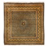 An extremely fine, signed silk Qum rug, central Persia
