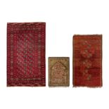 A group of three rugs including a fine silk prayer mat