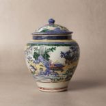 A rare Japanese Kakiemon 'landscape' jar and cover, Edo period, 17th century
