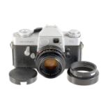 Leicaflex with 50mm f 2 Summicron R, With correct lens hood and cap.
