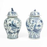A pair of Chinese porcelain blue and white jars and covers