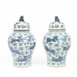 A pair of Chinese porcelain blue and white jars and covers