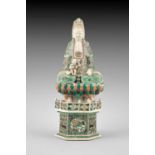 A Chinese enamel on biscuit figure of Guanyin