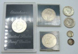 A 0.400 silver Eisenhower proof $1, a 1964 Kennedy