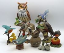 A collection of decorative bird ornaments includin