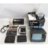 A boxed Roadstar TV-400N, a Technics RP-3215 microphone, a Sony Walkman & three other cassette