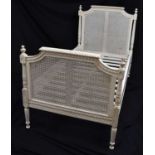 French-style cream painted single bed with caned head and footboards