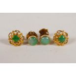Two pairs of green jade and yellow metal ear studs, 4g gross