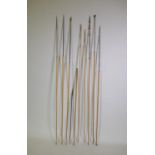 A quantity of African tribal throwing spears, fishing spears and arrows, with bamboo shafts and