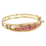 Early 20th century 9ct gold garnet and diamond hinged bangle