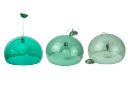 Three sage green Kartell 'FL/Y' ceiling lights.